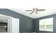 Bedroom featuring neutral walls, ceiling fan, and a window letting in natural light at 2351 Kelbrook Ct, Oviedo, FL 32765