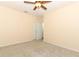 Empty bedroom with neutral walls, carpet, ceiling fan, and double door closet at 2351 Kelbrook Ct, Oviedo, FL 32765