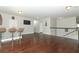 Bonus room featuring hardwood floors, stylish lighting, and a view of the staircase at 2351 Kelbrook Ct, Oviedo, FL 32765