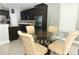 Kitchen view with a small dining area and glass table with decorative chairs at 2351 Kelbrook Ct, Oviedo, FL 32765