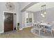 Formal dining area featuring a round table, stylish chairs, and modern pendant lighting fixture at 2351 Kelbrook Ct, Oviedo, FL 32765