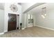 Welcoming foyer with beautiful hardwood floors, stylish lighting, and front door view at 2351 Kelbrook Ct, Oviedo, FL 32765