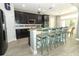 Stylish kitchen with dark cabinetry, granite countertops, and stainless steel appliances at 2351 Kelbrook Ct, Oviedo, FL 32765