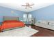 Main bedroom features a ceiling fan, large bed, and a sitting area at 2351 Kelbrook Ct, Oviedo, FL 32765