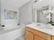 Relaxing bathroom with a soaking tub, a single sink vanity, and soft lighting for a spa-like experience at 275 Clydesdale Cir, Sanford, FL 32773