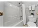 Bright bathroom with a white shower-tub combination and matching white toilet at 275 Clydesdale Cir, Sanford, FL 32773