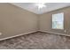 Bedroom featuring neutral walls, carpet, ceiling fan, and bright natural light at 275 Clydesdale Cir, Sanford, FL 32773