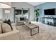 Bright living room with stylish furniture, a blue accent wall, and natural lighting at 275 Clydesdale Cir, Sanford, FL 32773