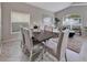 A view of the dining and living room space featuring neutral colors and natural light at 275 Clydesdale Cir, Sanford, FL 32773