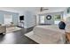 Light-filled main bedroom with wood flooring, a ceiling fan, and windows that let in plenty of natural light at 275 Clydesdale Cir, Sanford, FL 32773