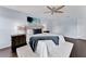 Bright main bedroom with a plush rug, ceiling fan, and a comfortable bed with decorative pillows and bedside tables at 275 Clydesdale Cir, Sanford, FL 32773