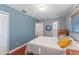 Bedroom with wooden dresser, wood floors, and mirror at 2805 Bongart Rd, Winter Park, FL 32792