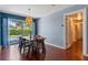 Dining room with hardwood floors, modern light fixture, and sliding glass doors to the outdoor space at 2805 Bongart Rd, Winter Park, FL 32792