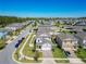 Aerial of a home with a paved driveway, well-maintained lawn, and a landscaped yard in a quiet neighborhood at 2820 Black Birch Dr, Ocoee, FL 34761