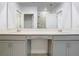 Bright bathroom featuring dual vanity and large mirror at 2820 Black Birch Dr, Ocoee, FL 34761