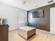 Bedroom featuring wood-look floors, track lighting and gray accent wall at 2820 Black Birch Dr, Ocoee, FL 34761