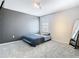 Inviting bedroom featuring a large window, gray carpet and accent wall at 2820 Black Birch Dr, Ocoee, FL 34761