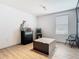 Bedroom featuring wood-look floors and modern track lighting at 2820 Black Birch Dr, Ocoee, FL 34761