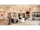 Clubhouse living room featuring comfortable seating, stone fireplace, stylish decor, and a welcoming atmosphere at 2820 Black Birch Dr, Ocoee, FL 34761