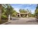 Community entrance with stone details, lush landscaping, and gated entry, providing a secure and welcoming environment at 2820 Black Birch Dr, Ocoee, FL 34761