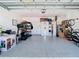 Spacious garage with epoxy flooring and ample storage space at 2820 Black Birch Dr, Ocoee, FL 34761