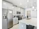 Gourmet kitchen features stainless steel appliances, a stylish faucet, and a large island for gathering and dining at 2820 Black Birch Dr, Ocoee, FL 34761