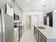 The kitchen features modern appliances, recessed lighting, and ample counter space for cooking and entertaining at 2820 Black Birch Dr, Ocoee, FL 34761