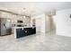 Modern kitchen features a large center island, stainless steel appliances, and white cabinetry for a sleek design at 2820 Black Birch Dr, Ocoee, FL 34761