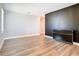 Spacious living room features modern vinyl plank floors, neutral walls, and a stylish dark accent wall at 2820 Black Birch Dr, Ocoee, FL 34761