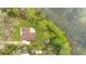 Overhead view showing the home's layout, patio, and proximity to the lake at 30041 Redoak Ave, Eustis, FL 32736