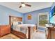 Comfortable bedroom with a large bed and lots of storage space at 30041 Redoak Ave, Eustis, FL 32736