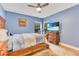 Comfortable bedroom with lots of natural light and a ceiling fan at 30041 Redoak Ave, Eustis, FL 32736