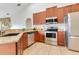 Well-equipped kitchen featuring stainless steel appliances and granite countertops at 30041 Redoak Ave, Eustis, FL 32736