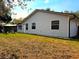 Wide-open backyard and outdoor seating offer a peaceful outdoor space for enjoyment at 3106 Garden Ct, St Cloud, FL 34769