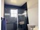 Bathroom featuring a black tile shower, and updated fixtures at 3106 Garden Ct, St Cloud, FL 34769