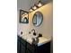 Bathroom vanity with a unique countertop and modern fixtures and lighting at 3106 Garden Ct, St Cloud, FL 34769