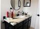 Bathroom vanity with a unique countertop and modern fixtures at 3106 Garden Ct, St Cloud, FL 34769