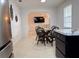 Bright dining room with a round table and views into the living room at 3106 Garden Ct, St Cloud, FL 34769