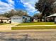 This single-Gathering home features a well-maintained lawn, a paved walkway, and a one-car garage at 3106 Garden Ct, St Cloud, FL 34769