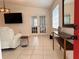 Bright living room with French doors and a console table by the window at 3106 Garden Ct, St Cloud, FL 34769