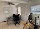 Office space features a white board, natural light, and tiled floors, suitable for productivity at 3106 Garden Ct, St Cloud, FL 34769