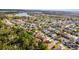 Scenic aerial shot of a neighborhood next to a lake with verdant trees at 3121 Bellingham Dr, Orlando, FL 32825