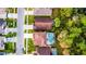 Aerial view of a home featuring a screened-in pool and lush landscaping at 3121 Bellingham Dr, Orlando, FL 32825