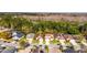 Aerial view of homes in a neighborhood near a large wooded conservation area at 3121 Bellingham Dr, Orlando, FL 32825