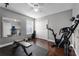 A well-equipped home gym featuring weights, a stationary bike, and a large mirror at 3121 Bellingham Dr, Orlando, FL 32825