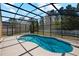 An expansive screened-in pool featuring pristine water and ample deck space perfect for relaxation and entertaining at 3180 Town And Country Rd, Oviedo, FL 32766