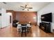 Cozy dining area with stylish chairs, a ceiling fan, and a decorative wall at 3403 Great Pond Dr, Kissimmee, FL 34746