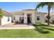 Charming front porch features a paved entry, seating area, and beautiful landscaping, creating a welcoming entrance at 3403 Great Pond Dr, Kissimmee, FL 34746