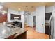 Modern kitchen featuring stainless steel appliances, granite countertops, and ample storage at 3403 Great Pond Dr, Kissimmee, FL 34746