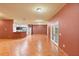 Spacious open-concept living and kitchen area, with ceramic tile flooring and a french door entrance at 3403 Great Pond Dr, Kissimmee, FL 34746